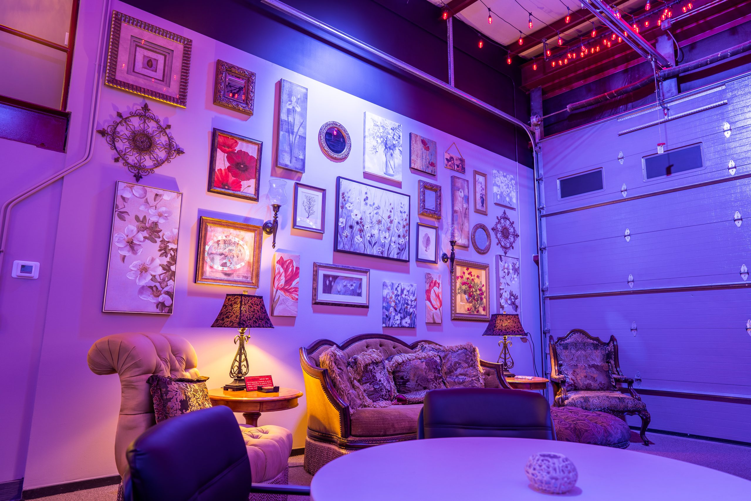 Gallery wall lounge with repurposed vintage furnishings